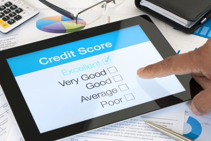 Credit score on a digital tablet with desk background